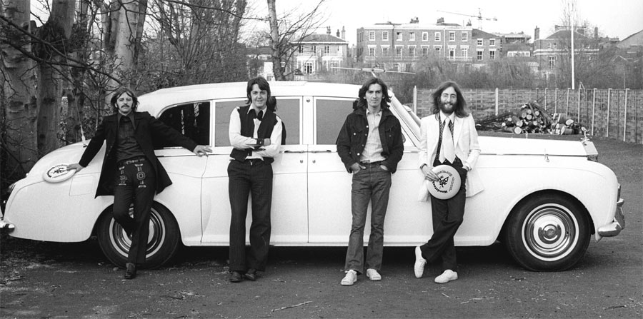 The Beatles in front of John's Rolls-Royce